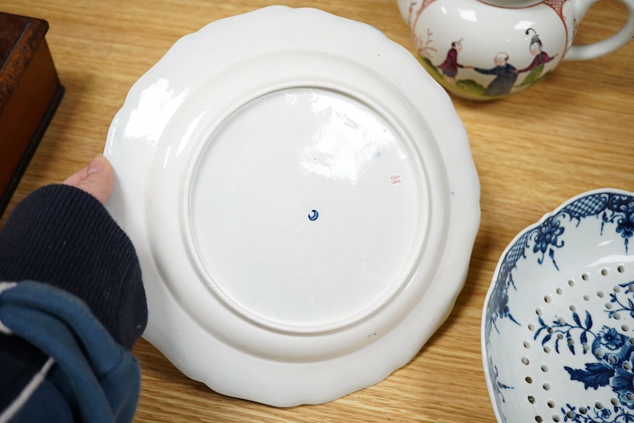 An 18th century Worcester Chinese style teapot, and a similar pine cone pattern strainer and plate (3). Condition - teapot cracked and chipped, others good